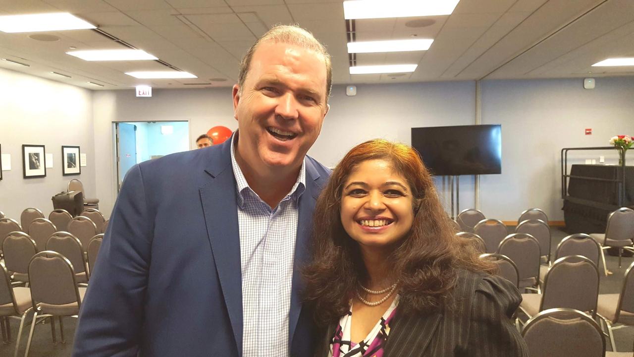 Geetha Krishnan with a fellow speaker at a professional event