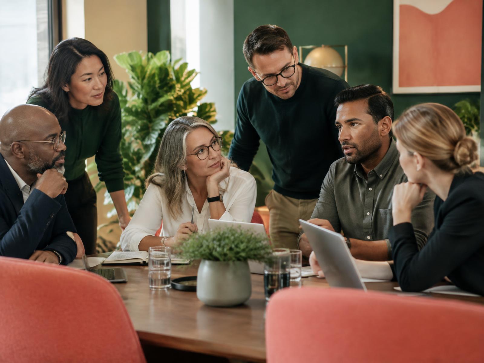 Professional team collaborating in a focused workplace discussion